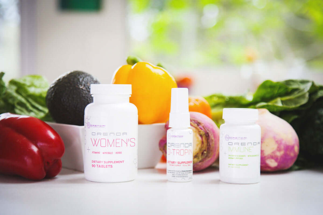 picture of the three bottle of the Orenda Womens Mid Life Balance bundle on a white countertop with vegetables in background